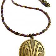 LOVE necklace. Purple & gold. Brass metal love circle pendant with glass seed beads. Beaded necklace. Boho. Hippie. simple.
