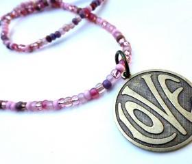 LOVE necklace. Brass metal love circle pendant with pink matte and shiny glass seed beads. Beaded necklace. Boho. Hippie. simple.