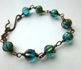Teal, aqua, brown pumpkin Czech Picasso glass wire wrapped bracelet. Jewelry, Glass, Teal, Aqua, brown.
